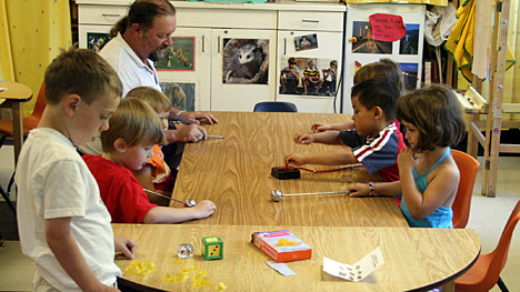 Photo of teacher with children in classroom