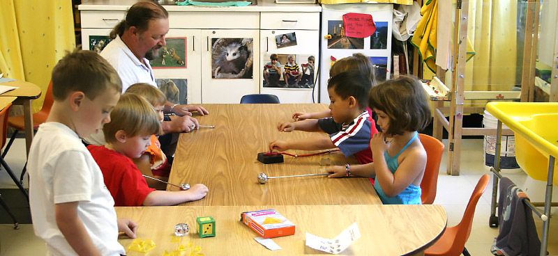 teacher playing with children