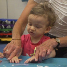 picture of child playing with slime