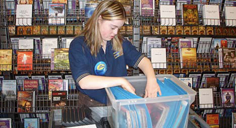 photo of girl working in video shop