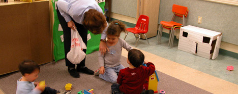 photo of teacher speaking with child