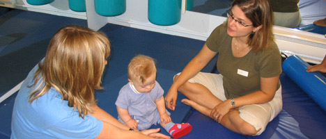 photo of parent speaking with teacher at daycare