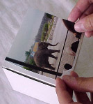 photo of putiting photo on cube